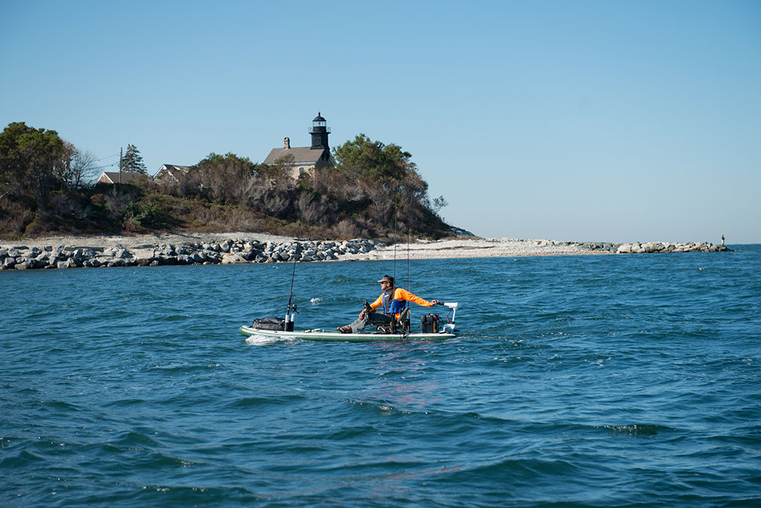 sup angler navigates kayaking hazards
