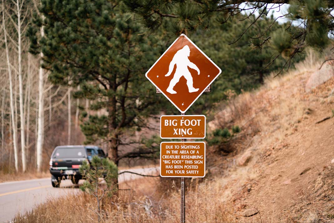 Bigfoot crossing sign along a highway, a good example of a camping myth