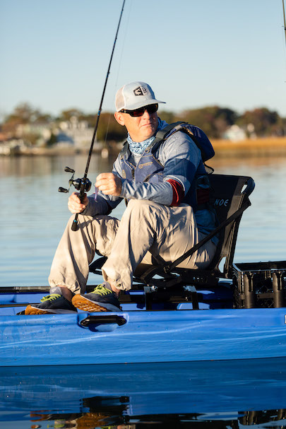 Man fishing from seated position on sit-on-top kayak