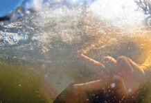 3 Pros On How To Perfect Your Kayak Roll underwater picture of a kayaker executing a kayak roll