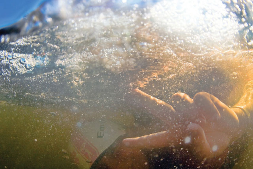 underwater picture of a kayaker executing a kayak roll