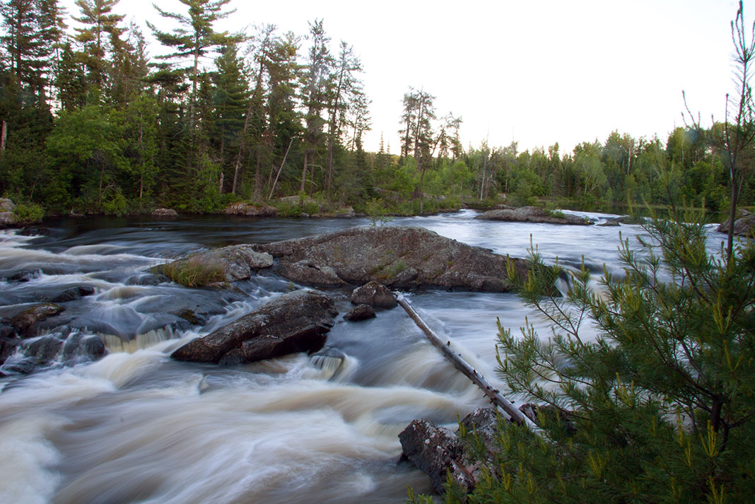 water flows over Lower Basswood Falls in Boundary Waters Canoe Area (BWCA)