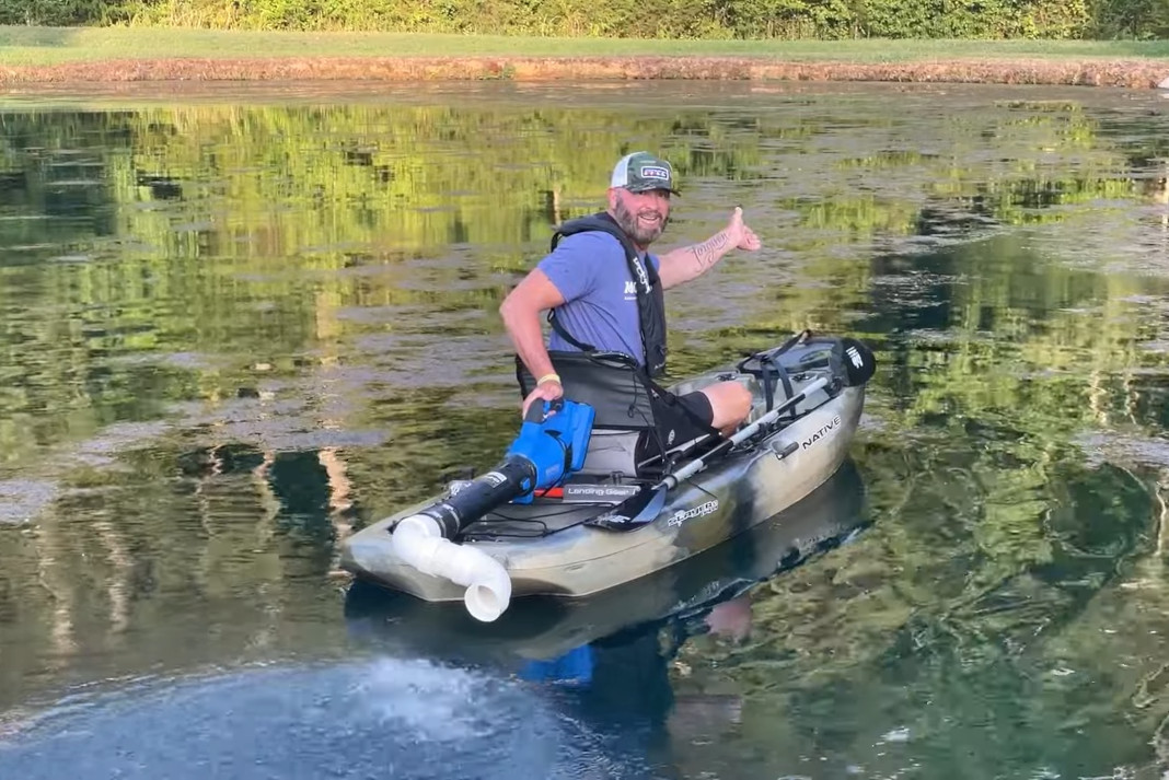 Gerald Swindle shows off hsi leaf blower powered kayak.