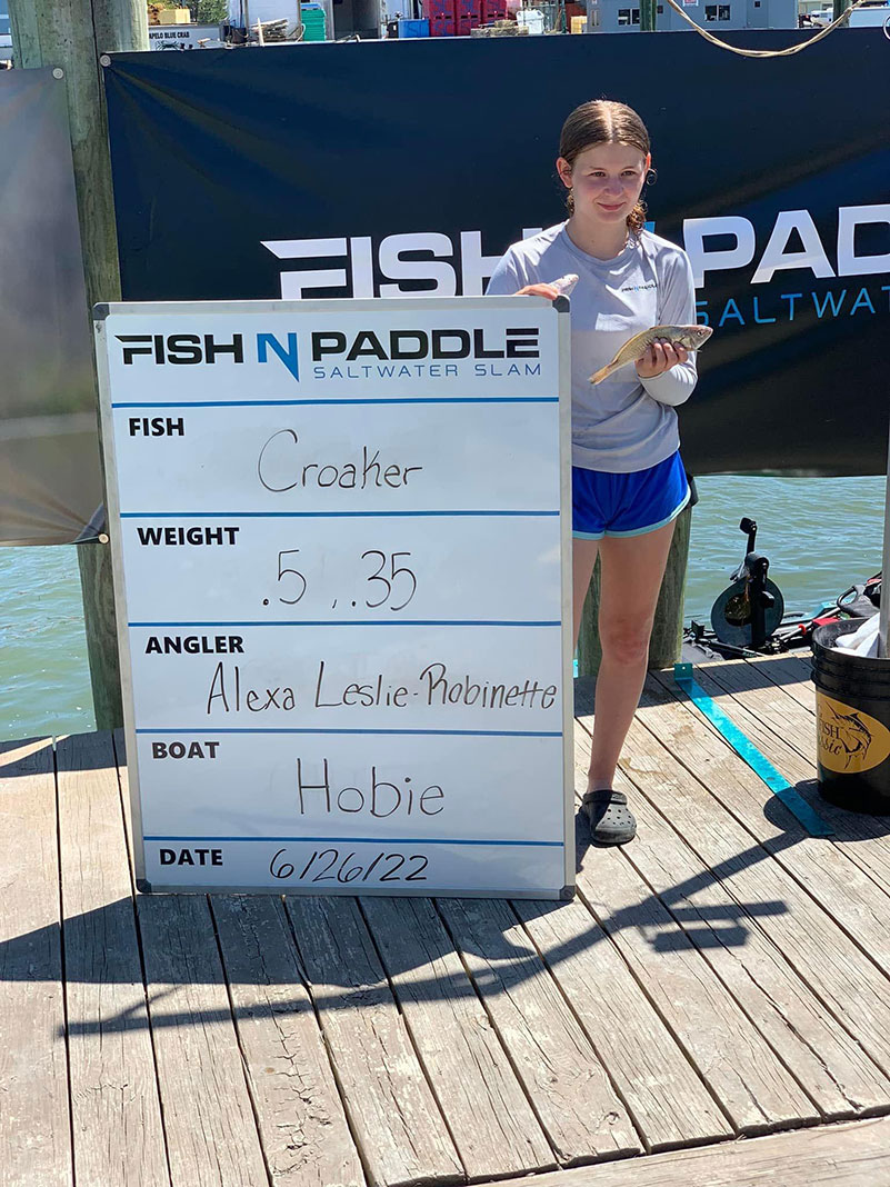 junior angler at the Fish N Paddle Saltwater Slam poses with her catch