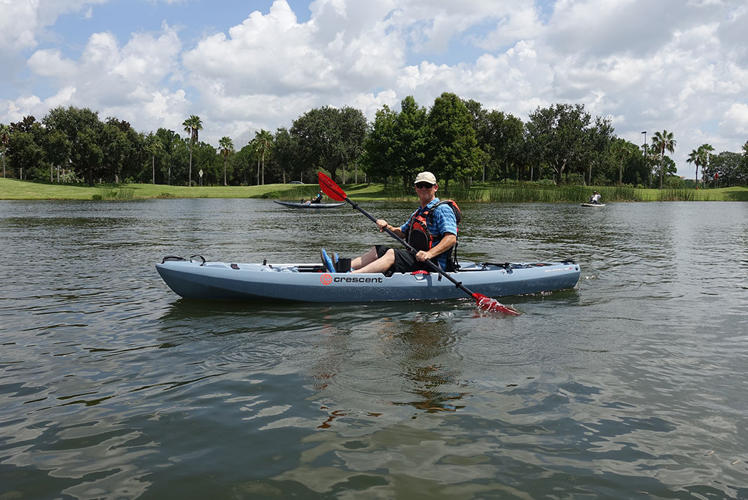 man paddles the Crescent Kayaks Shoalie at ICAST 2022