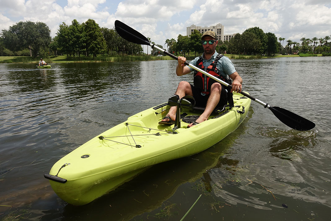 man paddles the new Hobie Passport R Series at ICAST