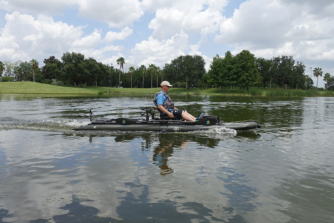 man rides on a kayak powered by a Torqeedo motor at ICAST 2022
