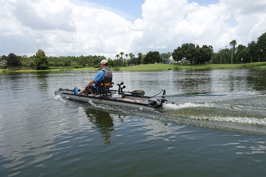 man rides on a kayak powered by a Torqeedo motor at ICAST 2022