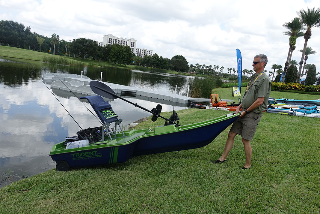 Man launches Trident Explorer kayak at ICAST 2022