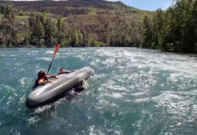 two kayakers about to be rescued after capsizing on the Kenai River in Alaska