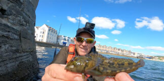 angler holds up one (very small) catch at the Swanage Classic 2022