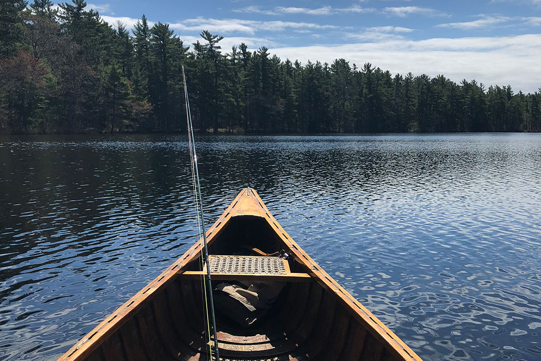 fishing rod in the bow of a canoe in Michigan's Upper Peninsula