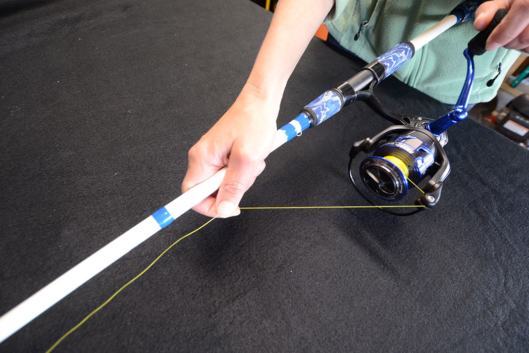 man demonstrates how to spool a fishing reel with the right line