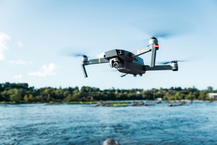 drone flies rescue mission over a lake
