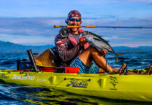 man poses with yellowfin tuna caught by kayak off Panama
