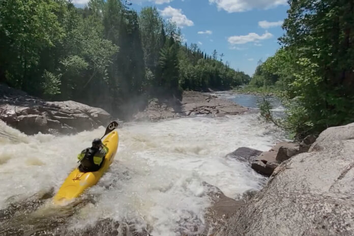 RMX Kayak entering a rapid.