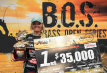 kristine fischer poses with her tournament check after winning the 2021 Hobie BOS