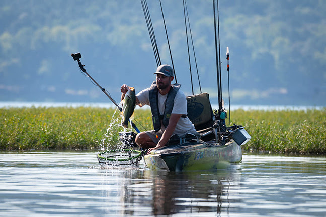 Angler with bass during Hobie BOS