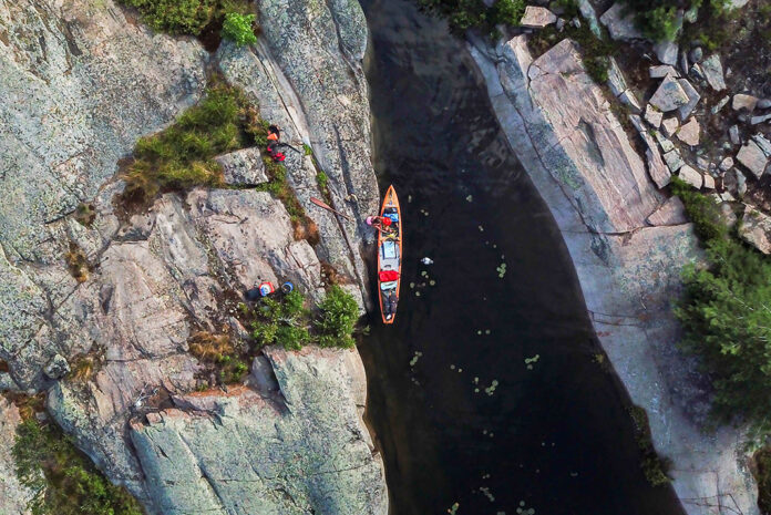 a canoe stops at Bigsby Island in Lake Huron during a father-daughter tandem expedition