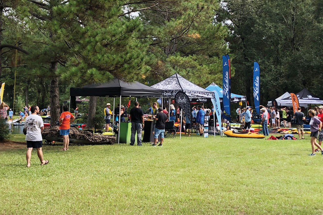 people attend a kayaking event sponsored by Austin Canoe and Kayak