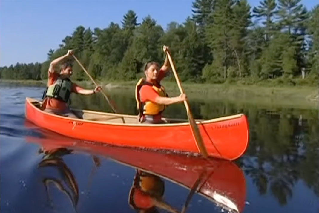 man and woman in canoe demonstrate 3 golden rules of canoeing