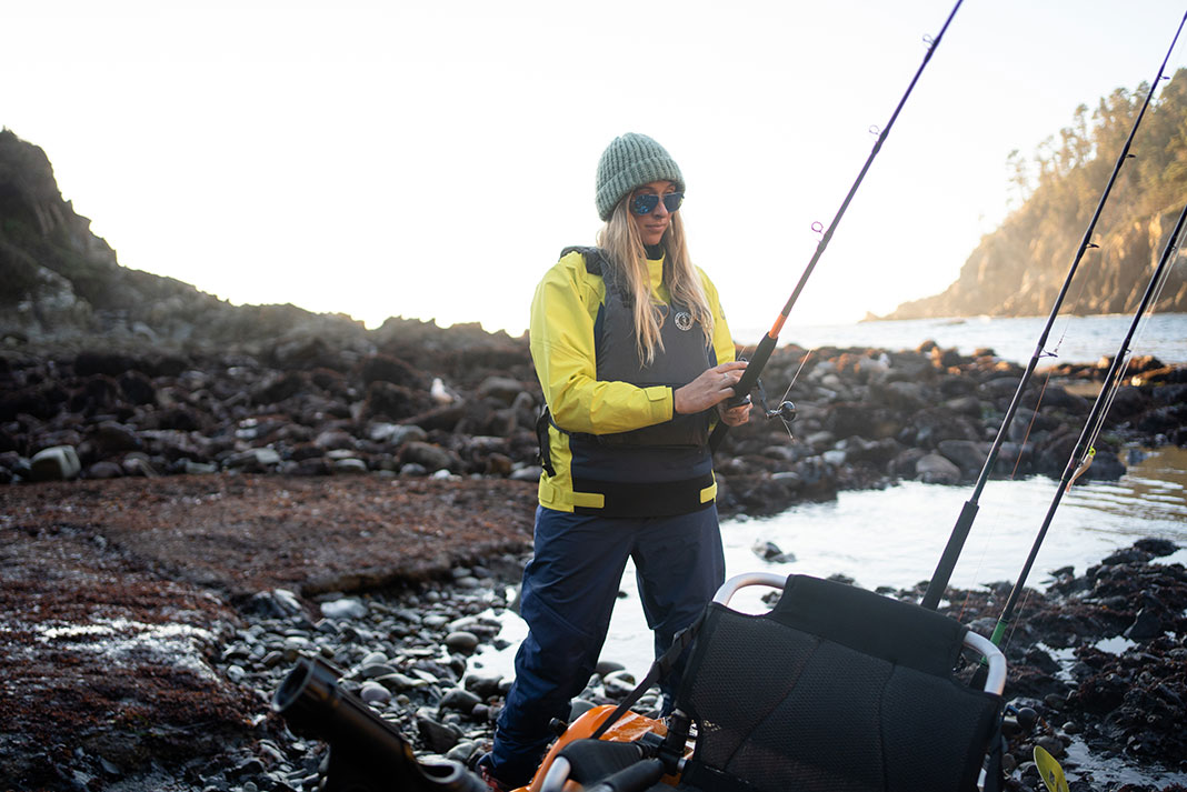 Annie Nagel prepares her rods to go out kayak fishing