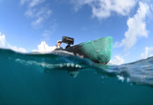 Below water view of person on fishing kayak