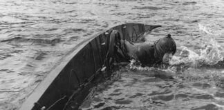 British sea kayaking pioneer Ken Taylor demonstrates chest swelling at Loch Lomond in 1960