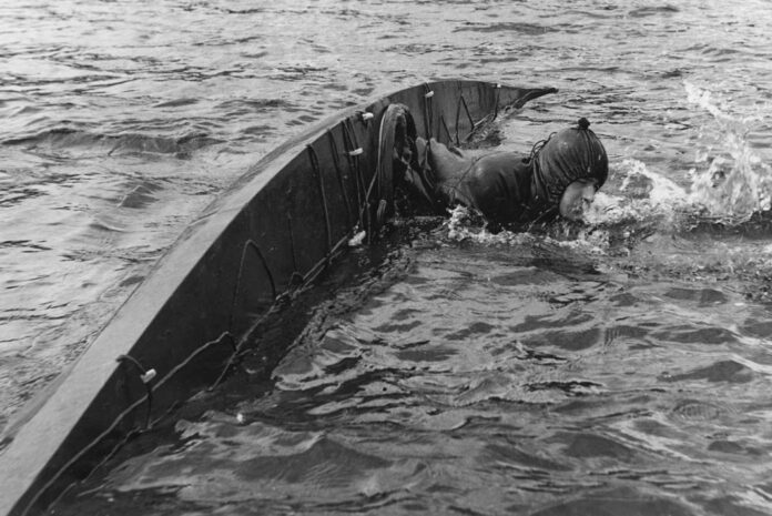 British sea kayaking pioneer Ken Taylor demonstrates chest swelling at Loch Lomond in 1960