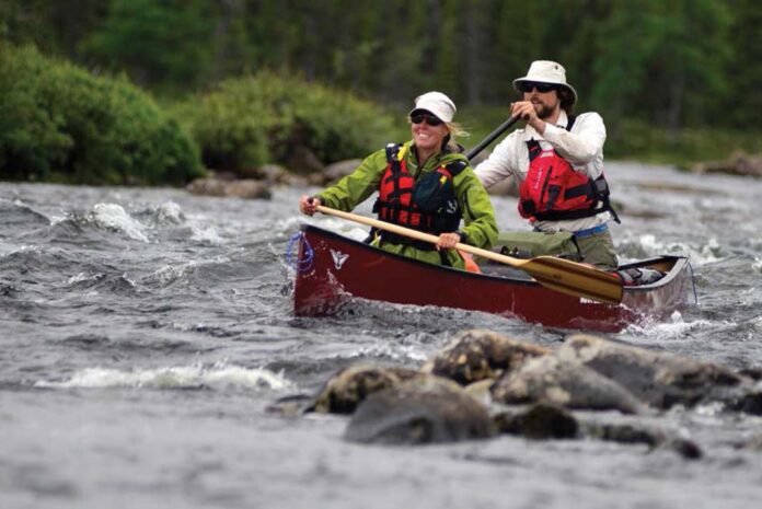 Happy canoeists on river
