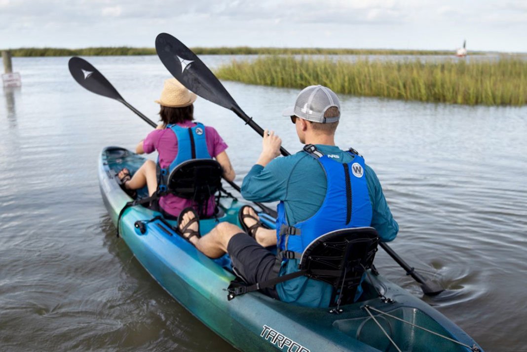 Two people in a tandem sit-on kayak