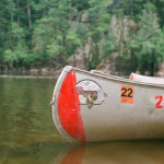 Everything You Need To Know About Buying A Grumman Canoe Grumman canoe sits on lake