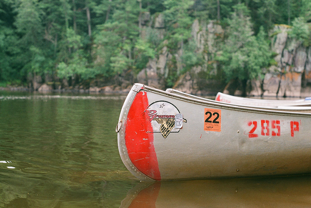 Grumman canoe sits on lake