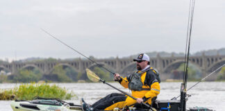 Angler fishing in a drysuit in his kayak