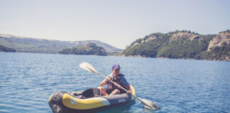 man paddles a Sevylor inflatable kayak