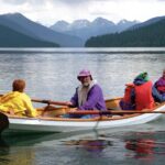 JOHN LOCKWOOD ROWING WITH FREYA (BOW) AND FRIENDS, BOWRON LAKES, 1995. “SUCH EXPERIENCES ON THE WILD EARTH ARE THE BEST I HAVE TO GIVE MY CHILD.”| PHOTOS: COURTESY PYGMY BOATS ARCHIVE AND FENNWOOD PHOTOGRAPHY