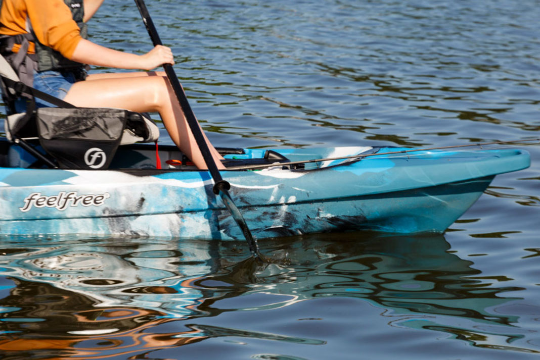 detail of person paddling the Lure II tandem kayak
