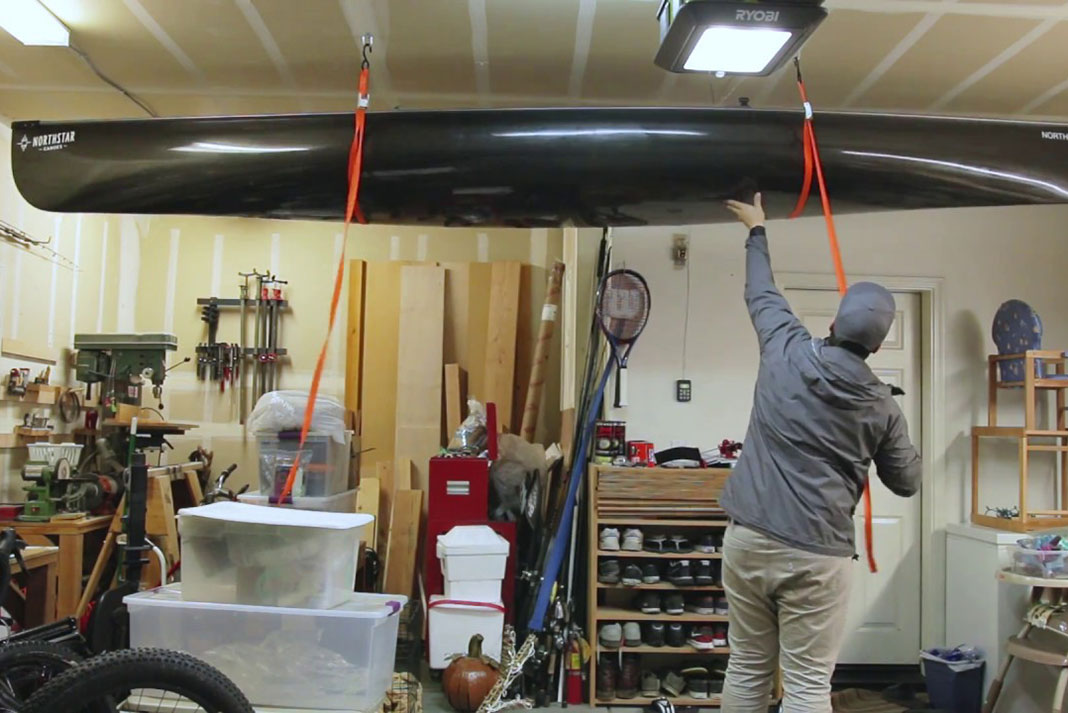 man demonstrates how to make a DIY canoe or kayak ceiling storage setup