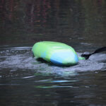 12 Tips For Troubleshooting Your Kayak Roll person rolls a whitewater kayak