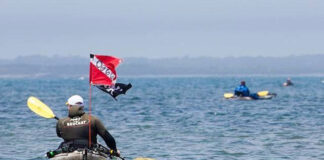anglers take part in a kayak spearfishing tournament