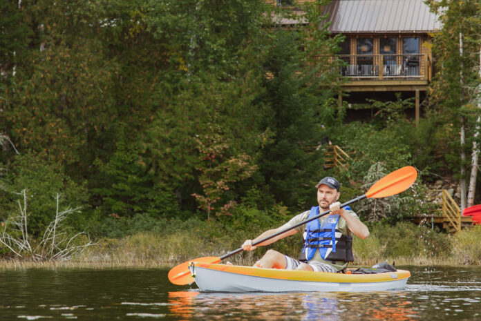 man paddles Pelican kayak constructed of Ram-X material