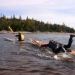 6 Unusual Skills That Will Make You A Better Kayaker one kayaker uses his skills to tow another in an unusual kayak relay race