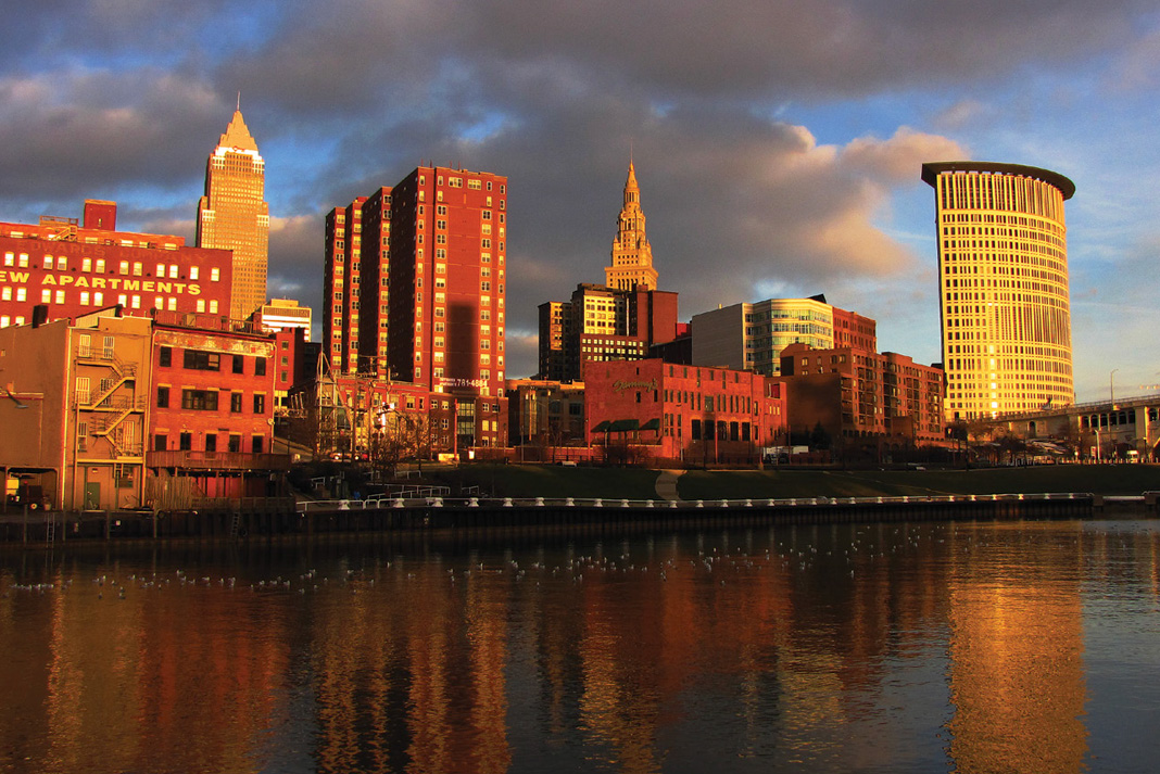 The skyline of Cleveland along the Cayuga River at dusk