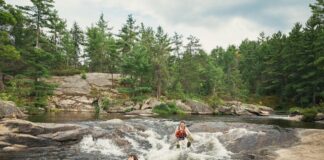 people sit in High Falls at Algonquin Park