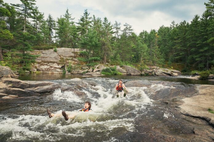 people sit in High Falls at Algonquin Park