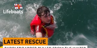 paddleboarder pulled from the water after calling for rescue on his cell phone