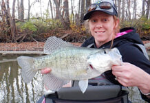 person holds up a crappie caught in fall with light tackle