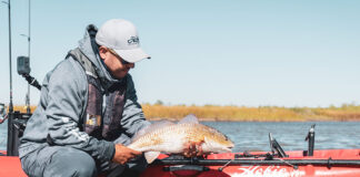 Hobie fishing team member Ben Maldonado poses with a redfish