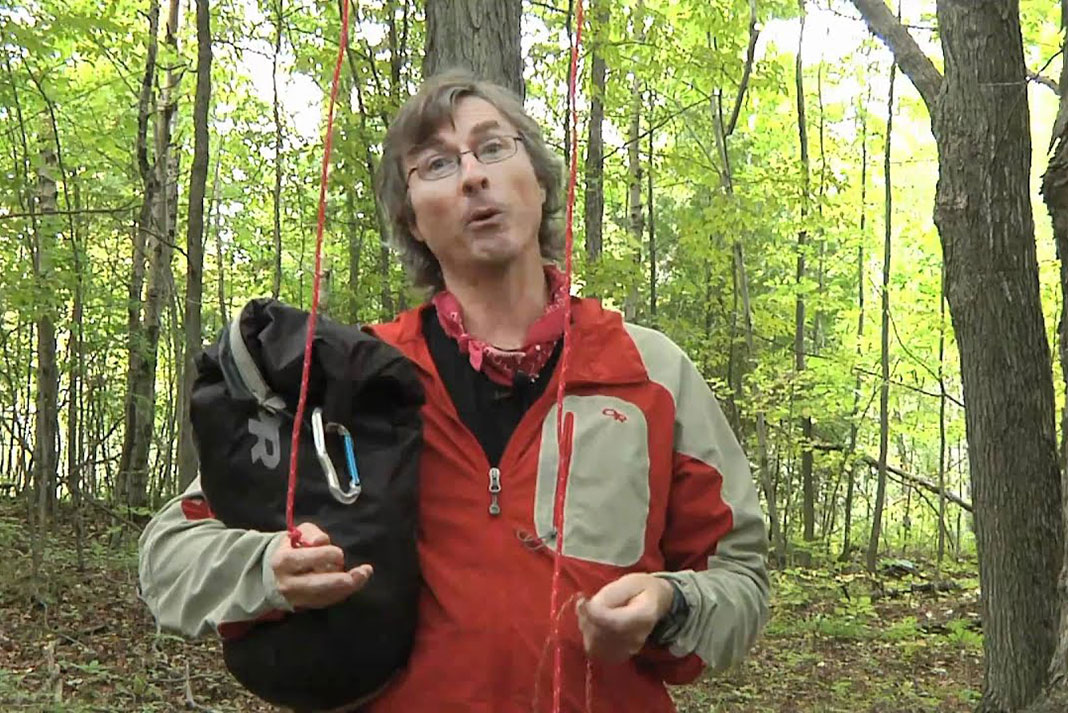 Kevin Callan demonstrates how to hang a bear bag