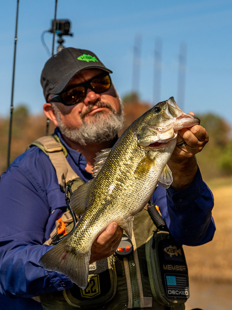 Chad Hoover holds up a bass caught in North Alabama